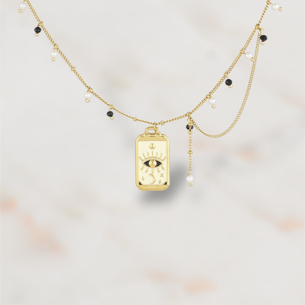Collier doré en acier inoxydable avec pendentif œil mystique et perles – Bijou tendance pour femme."